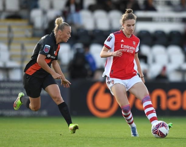 Vivianne Miedema of Arsenal passes the ball under pressure from Hanna Bennison of Everton during the Barclays FA Women's Super League match between...