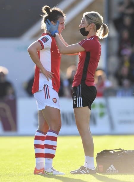 Lotte Wubben-Moy of Arsenal is checked out by Arsenal Physio Rose Glendinning during the Barclays FA Women's Super League match between Arsenal Women...
