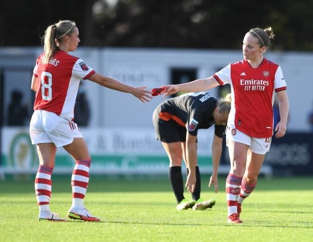 Kim Little hands Jordan Nobbs of Arsenal the captains armband during the Barclays FA Women's Super League match between Arsenal Women and Everton...