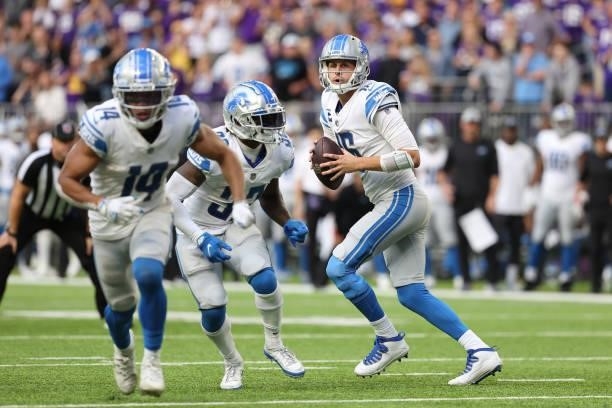 Jared Goff of the Detroit Lions looks to throw the ball during the fourth quarter against the Minnesota Vikings at U.S. Bank Stadium on October 10,...