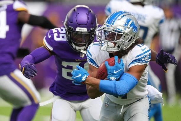 Kalif Raymond of the Detroit Lions is tackled by Kris Boyd of the Minnesota Vikings during a fourth quarter punt return at U.S. Bank Stadium on...