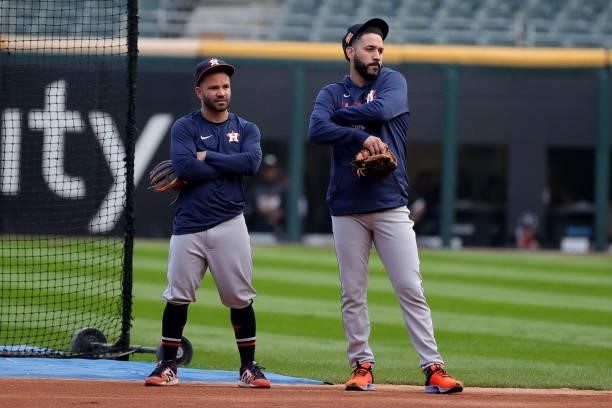 Jose Altuve and Marwin Gonzalez of the Houston Astros warm up prior to game 3 of the American League Division Series against the Chicago White Sox at...