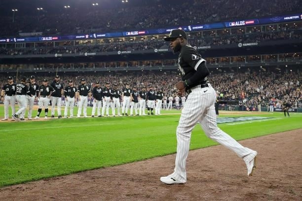 Luis Robert of the Chicago White Sox runs onto the field during the pre-game ceremonies prior to game 3 of the American League Division Series...