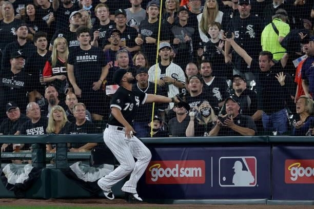 Jose Abreu of the Chicago White Sox misses a foul ball in the first inning during game 3 of the American League Division Series against the Houston...