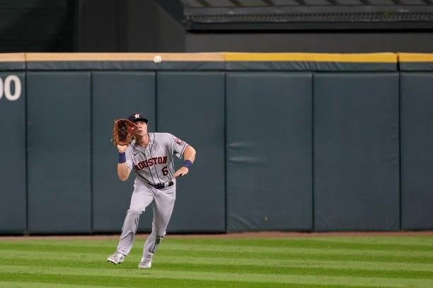 Jake Meyers of the Houston Astros catches a fly ball in the first inning during game 3 of the American League Division Series against the Chicago...