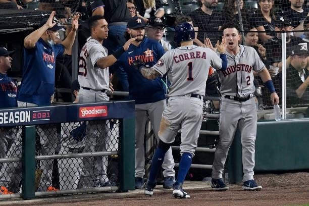 Carlos Correa of the Houston Astros celebrates with Alex Bregman of the Houston Astros in the second inning during game 3 of the American League...