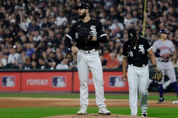 Jose Abreu of the Chicago White Sox walks to the mound to talk to Dylan Cease of the Chicago White Sox in the second inning during game 3 of the...