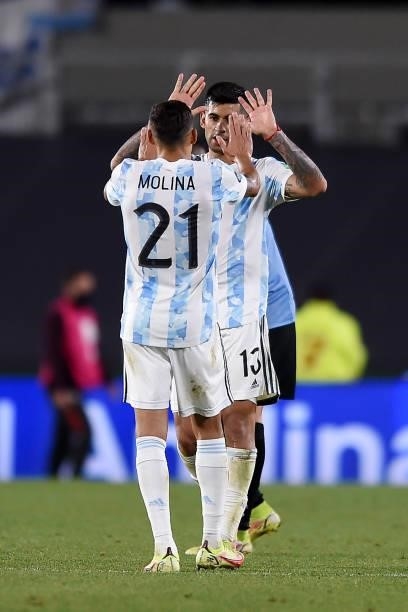 Cristian Romero and Nahuel Molina of Argentina celebrate after winning a match between Argentina and Uruguay as part of South American Qualifiers for...