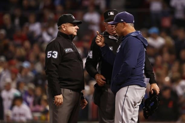 Manager Kevin Cash of the Tampa Bay Rays talks to umpires after Kevin Kiermaier of the Tampa Bay Rays hit a ground rule double in the 13th inning...