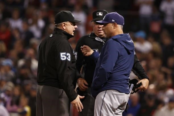 Manager Kevin Cash of the Tampa Bay Rays talks to umpires after Kevin Kiermaier of the Tampa Bay Rays hit a ground rule double in the 13th inning...