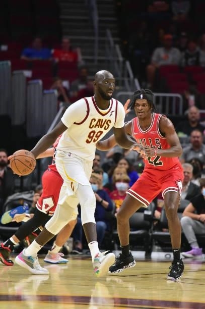 Tacko Fall of the Cleveland Cavaliers looks for a pass while under pressure from Alize Johnson of the Chicago Bulls during the fourth quarter at...