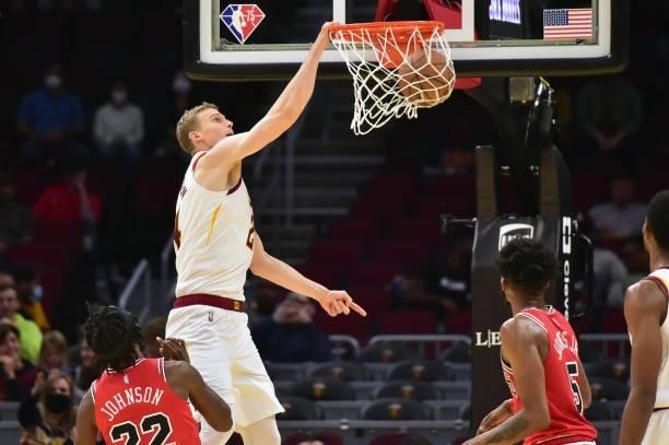 Lauri Markkanen of the Cleveland Cavaliers dunks over Alize Johnson and Derrick Jones Jr. #5 of the Chicago Bulls during the fourth quarter at Rocket...
