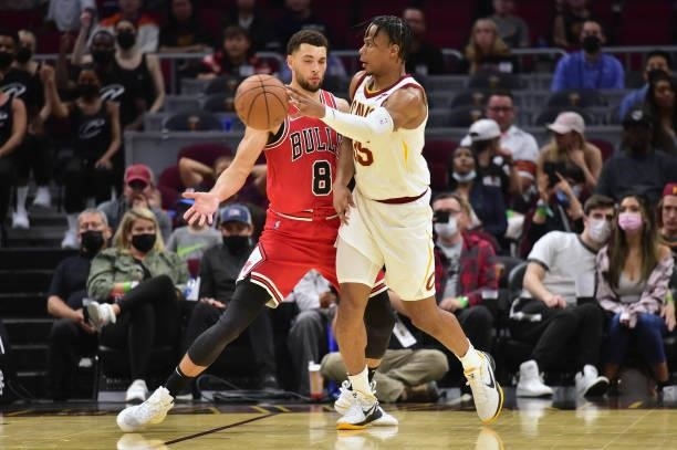 Isaac Okoro of the Cleveland Cavaliers passes around Zach LaVine of the Chicago Bulls during the fourth quarter at Rocket Mortgage Fieldhouse on...