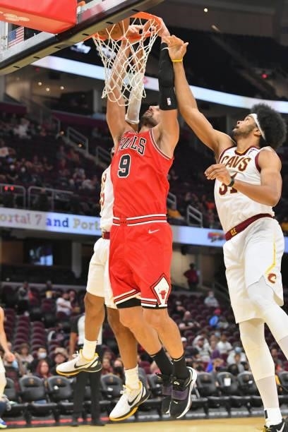 Nikola Vucevic of the Chicago Bulls dunsk over Jarrett Allen of the Cleveland Cavaliers during the third quarter at Rocket Mortgage Fieldhouse on...
