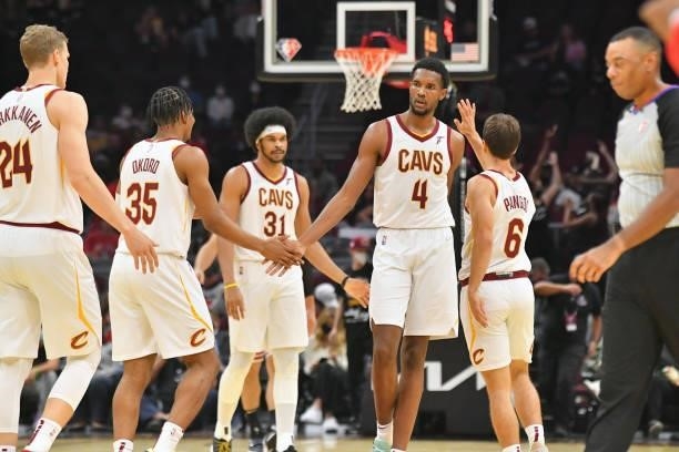 Lauri Markkanen Isaac Okoro Jarrett Allen Evan Mobley and Kevin Pangos of the Cleveland Cavaliers celebrate during the third quarter against the...