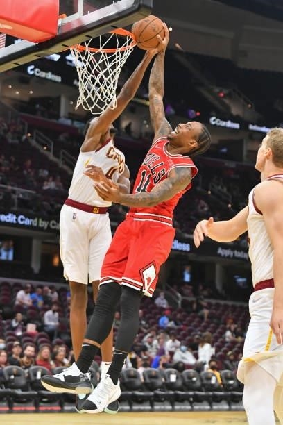 Evan Mobley of the Cleveland Cavaliers blocks DeMar DeRozan of the Chicago Bulls during the third quarter at Rocket Mortgage Fieldhouse on October...