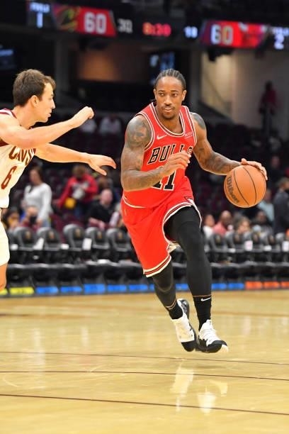 DeMar DeRozan of the Chicago Bulls drives to the basket around Kevin Pangos of the Cleveland Cavaliers during the third quarter at Rocket Mortgage...