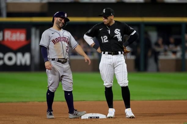 Jose Altuve of the Houston Astros and Cesar Hernandez of the Chicago White Sox chat in the fourth inning during game 3 of the American League...
