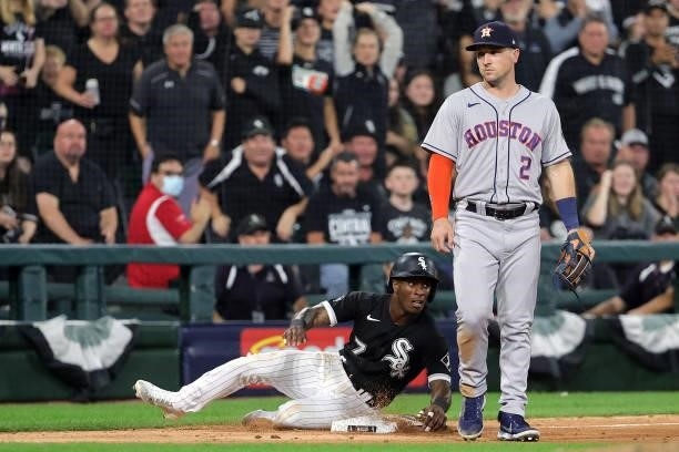 Tim Anderson of the Chicago White Sox slides into third in the fourth inning during game 3 of the American League Division Series against the Houston...