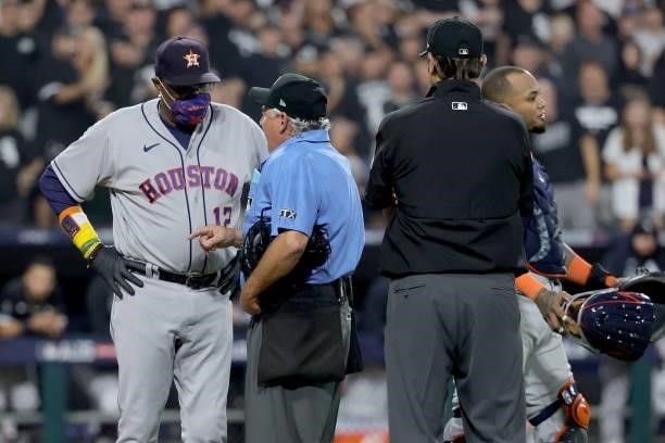 Manager Dusty Baker Jr. #12 of the Houston Astros talks with an umpire in the fourth inning during game 3 of the American League Division Series...