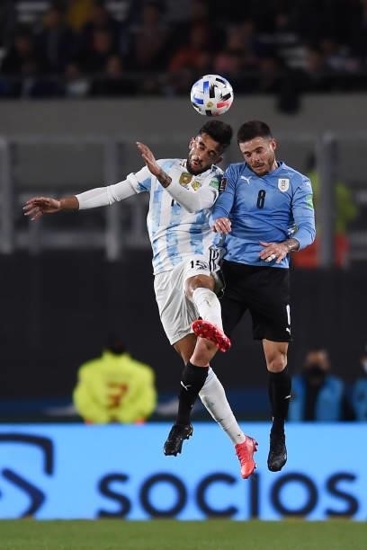 Nicolás Gonzalez of Argentina heads the ball against Nahitan Nandez of Uruguay during a match between Argentina and Uruguay as part of South American...