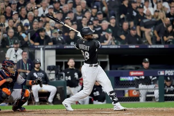 Luis Robert of the Chicago White Sox singles in the in the fourth inning during game 3 of the American League Division Series against the Houston...