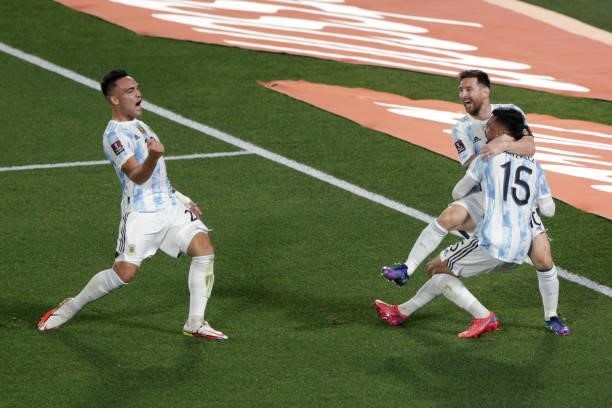 Lionel Messi of Argentina celebrates with teammate Nicolás Gonzalez after scoring the first goal of his team during a match between Argentina and...