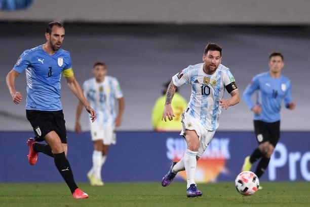 Lionel Messi of Argentina controls the ball against Diego Godin of Uruguay during a match between Argentina and Uruguay as part of South American...