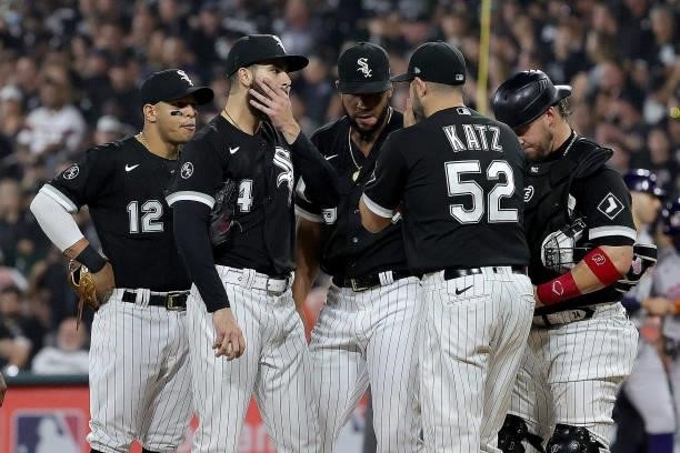 Dylan Cease of the Chicago White Sox speaks with Ethan Katz of the Chicago White Sox in the second inning during game 3 of the American League...
