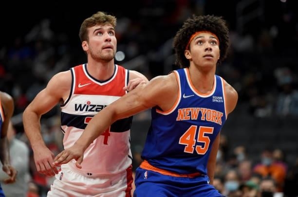 Jericho Sims of the New York Knicks boxes out against Corey Kispert of the Washington Wizards at Capital One Arena on October 09, 2021 in Washington,...