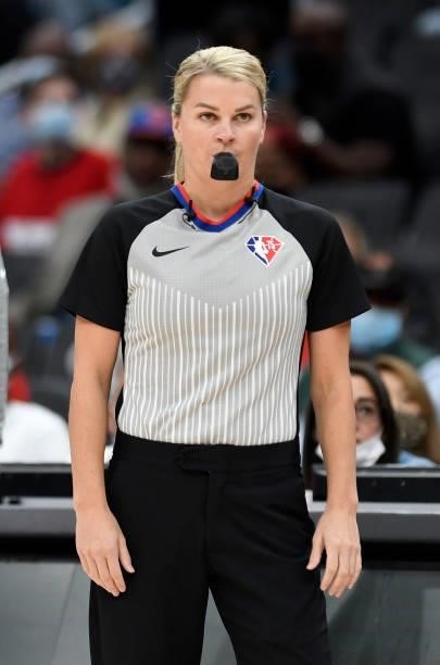 Referee Jenna Schroeder officiates the game between the Washington Wizards and the New York Knicks at Capital One Arena on October 09, 2021 in...