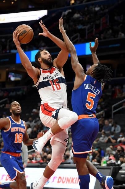 Anthony Gill of the Washington Wizards drives to the hoop in the second half against Immanuel Quickley of the New York Knicks at Capital One Arena on...