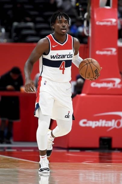 Aaron Holiday of the Washington Wizards handles the ball against the New York Knicks at Capital One Arena on October 09, 2021 in Washington, DC. NOTE...