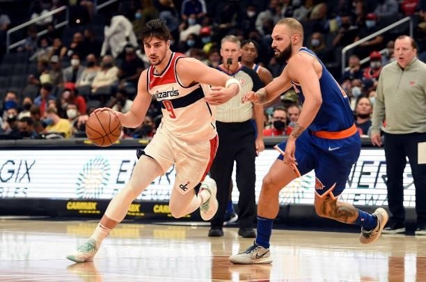 Deni Avdija of the Washington Wizards handles the ball in the second half against Evan Fournier of the New York Knicks at Capital One Arena on...
