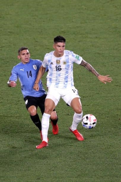 Joaquín Correa of Argentina fights for the ball with Lucas Torreira of Uruguay during a match between Argentina and Uruguay as part of South American...