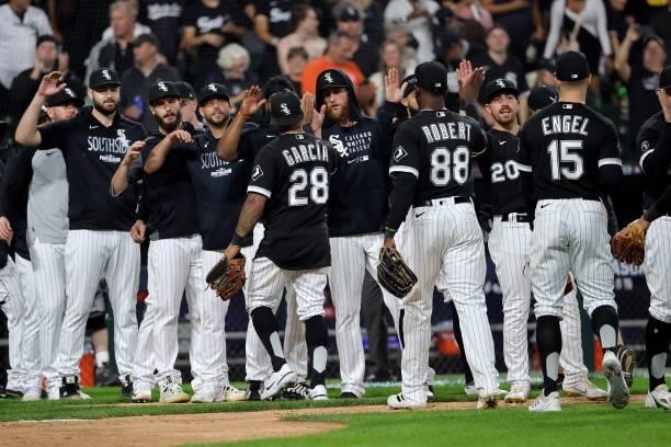 Leury Garcia of the Chicago White Sox celebrates with his team after a win over Houston Astros in game 3 of the American League Division Series at...