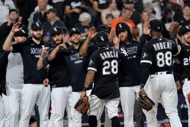 Leury Garcia of the Chicago White Sox celebrates with his team after a win over Houston Astros in game 3 of the American League Division Series at...