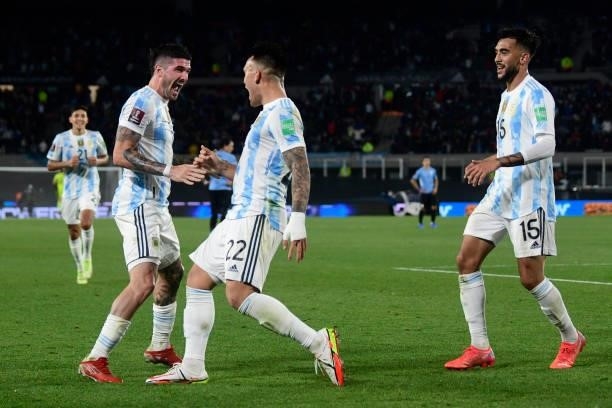 Lautaro Martinez of Argentina celebrates scoring his side's third goal with teammate Rodrigo De Paul during a match between Argentina and Uruguay as...
