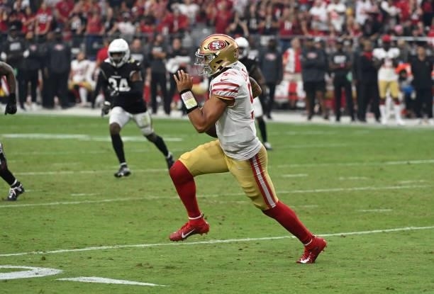 Trey Lance of the San Francisco 49ers runs with the ball against the Arizona Cardinals at State Farm Stadium on October 10, 2021 in Glendale, Arizona.