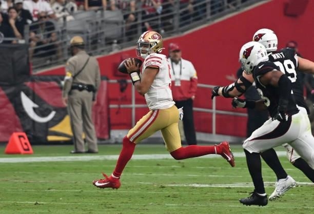 Trey Lance of the San Francisco 49ers looks to throw the ball against the Arizona Cardinals at State Farm Stadium on October 10, 2021 in Glendale,...