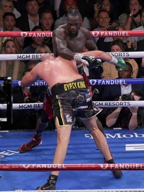 Deontay Wilder punches Tyson Fury during the World Heavyweight Championship III trilogy fight at T-Mobile Arena Saturday October 9, 2021. Tyson Fury...
