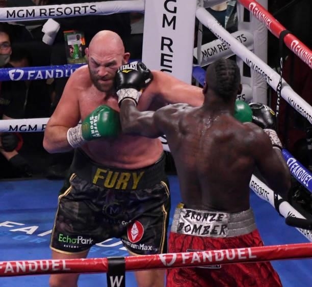 Tyson Fury punches Deontay Wilder during the World Heavyweight Championship III trilogy fight at T-Mobile Arena Saturday October 9, 2021. Tyson Fury...