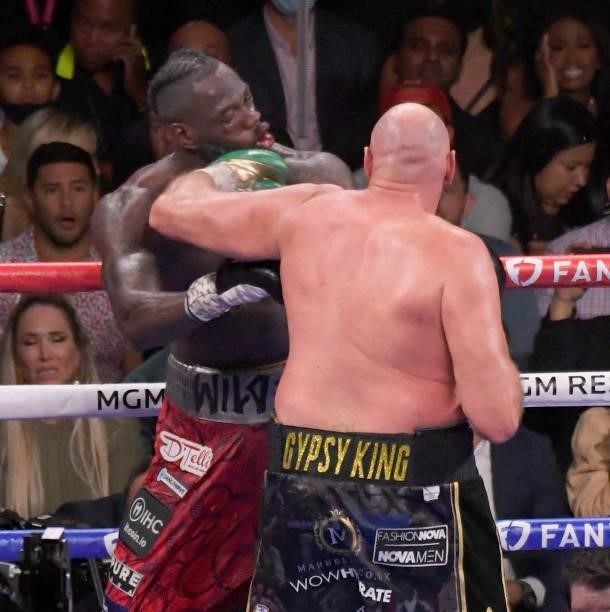 Tyson Fury punches Deontay Wilder during the World Heavyweight Championship III trilogy fight at T-Mobile Arena Saturday October 9, 2021. Tyson Fury...