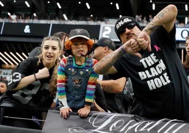 Las Vegas Raiders fans pose before the team's game against the Chicago Bears at Allegiant Stadium on October 10, 2021 in Las Vegas, Nevada. The Bears...