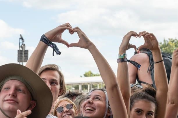 Fans hold up heart hands during Austin City Limits Festival at Zilker Park on October 10, 2021 in Austin, Texas.