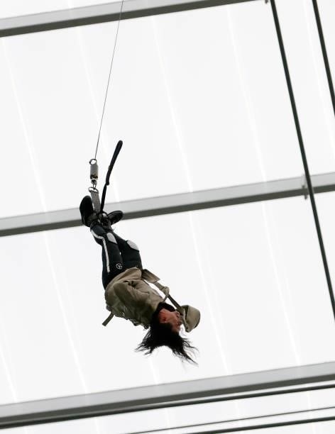 Illusionist Criss Angel escapes from a straitjacket while hanging above the field before a game between the Chicago Bears and the Las Vegas Raiders...