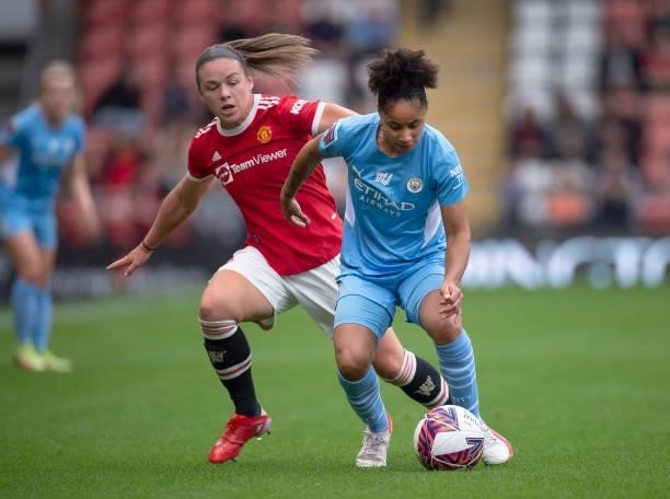 Kirsty Hanson of Manchester United and Demi Stokes of Manchester City in action during the Barclays FA Women's Super League match between Manchester...