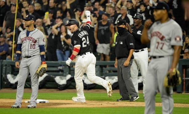 Yasmani Grandal of the Chicago White Sox reacts after hitting a two-run home run in the third inning during Game Three of the American League...