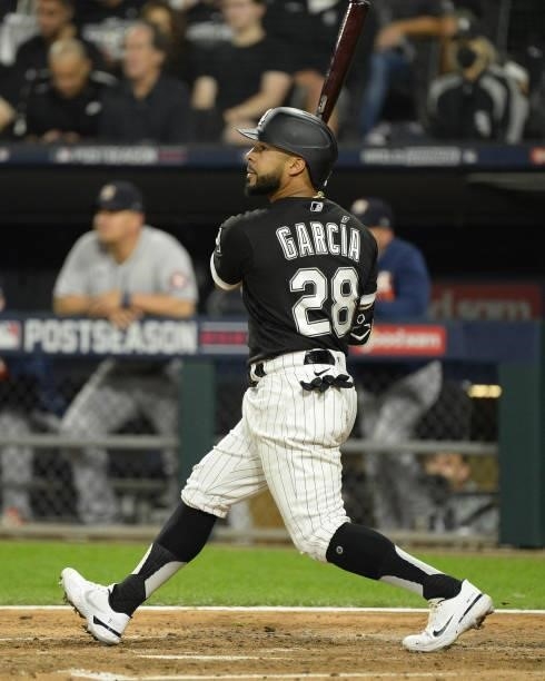 Leury Garcia of the Chicago White Sox hits a three-run home run in the third inning during Game Three of the American League Division Series against...