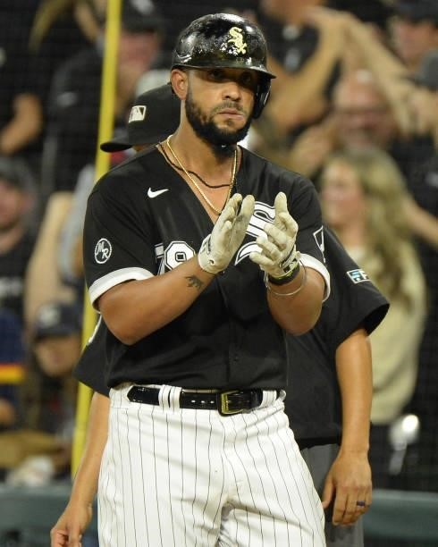 Jose Abreu of the Chicago White Sox reacts after hitting an RBI single in the fourth inning during Game Three of the American League Division Series...